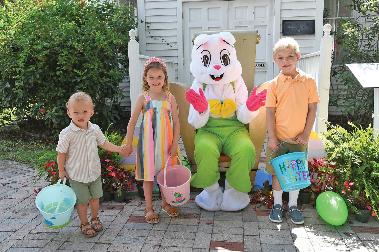 Photos with the Easter Bunny are all part of the fun. [Photo by Doreen Poreba]